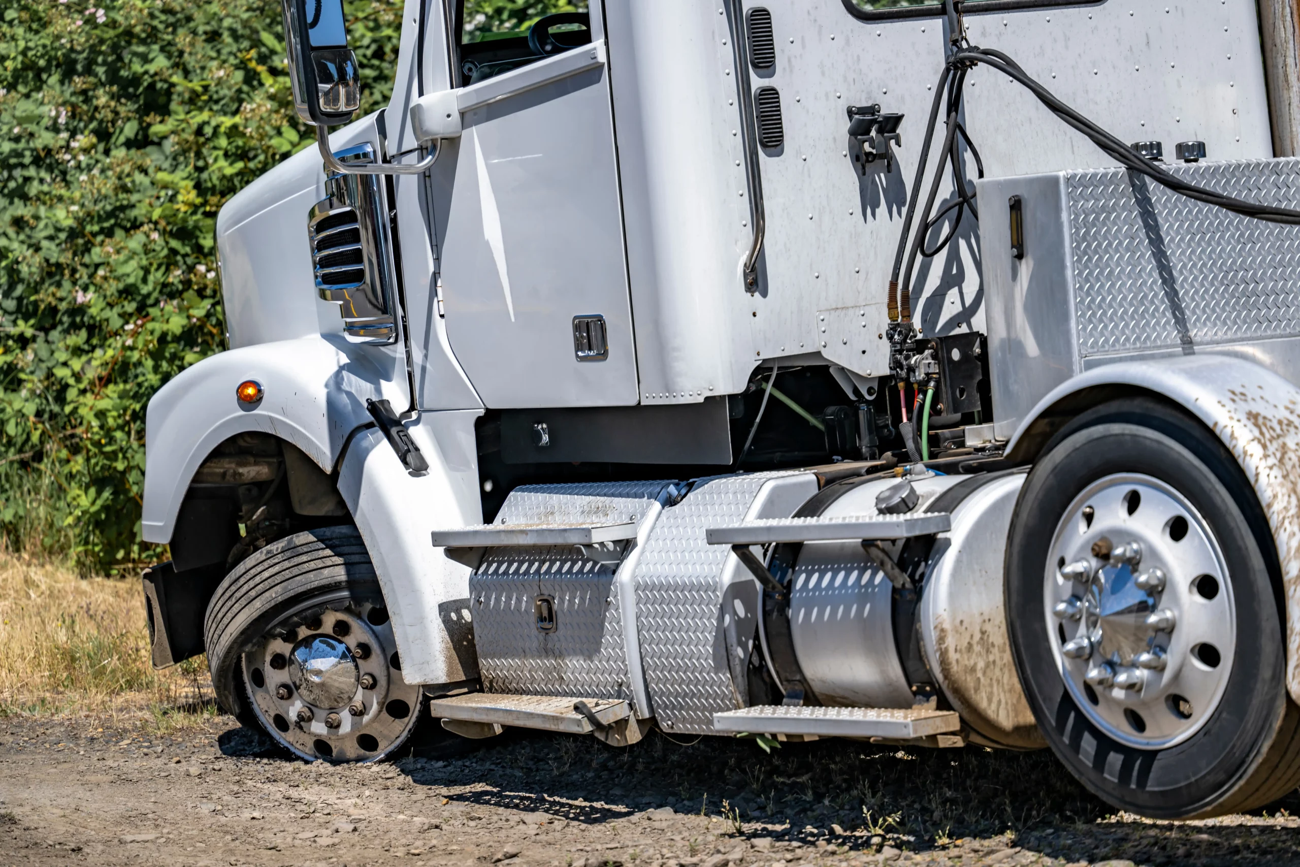 White semi truck off the road in accident