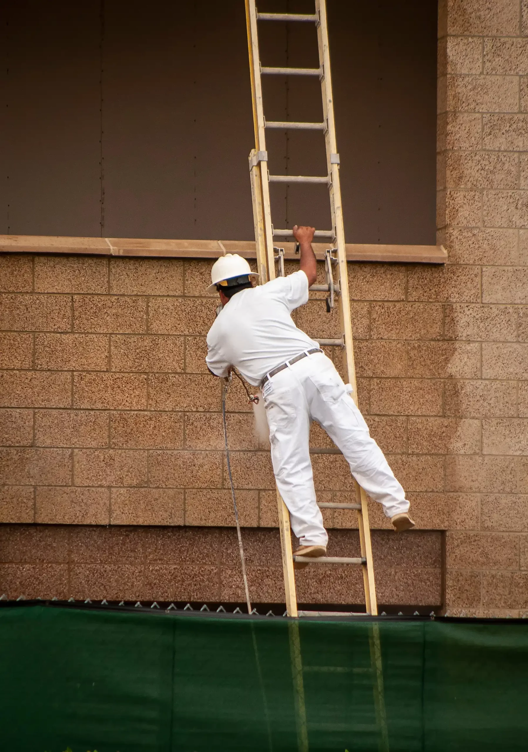 worker on a ladder in cincinnati