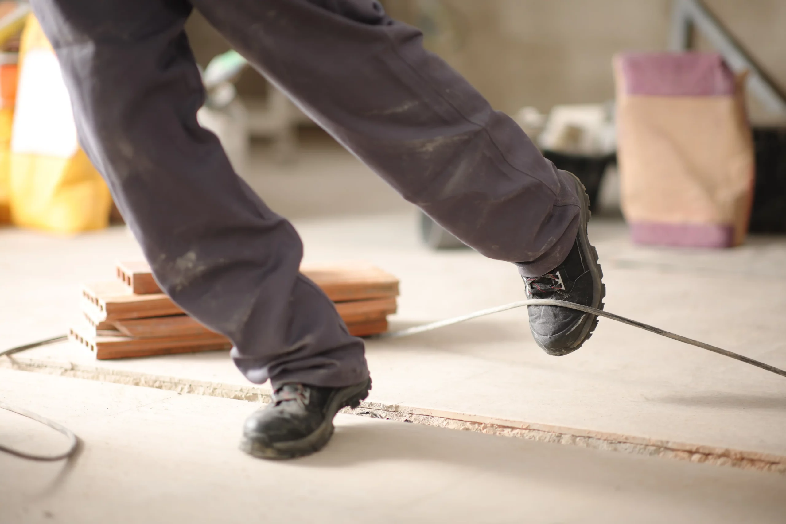 worker trips on wire