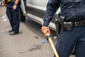 An image of a police officer holding a batton
