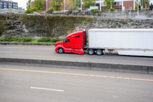 An image of a truck driving down the road
